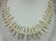 Freshwater white toothpick pearl necklace with pearl roundel spacers