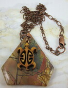 Picasso jasper gemstone pendant with a carved wood turtle (honu)